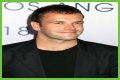 Jonny Lee Miller flashes ink for Ellen charity